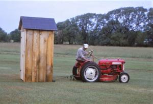 John T taking the Outhouse to the back of the property